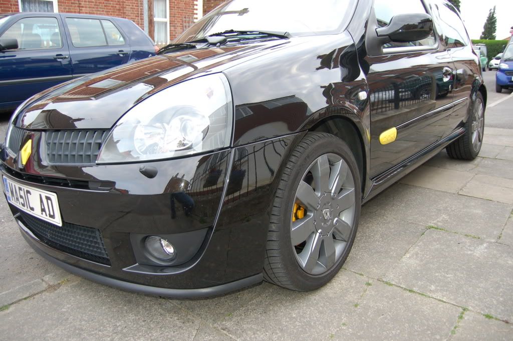 Yellow calipers on black car